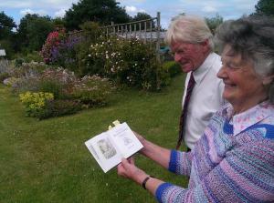 President Mike with Janie Smith and Beatrix Potter book.